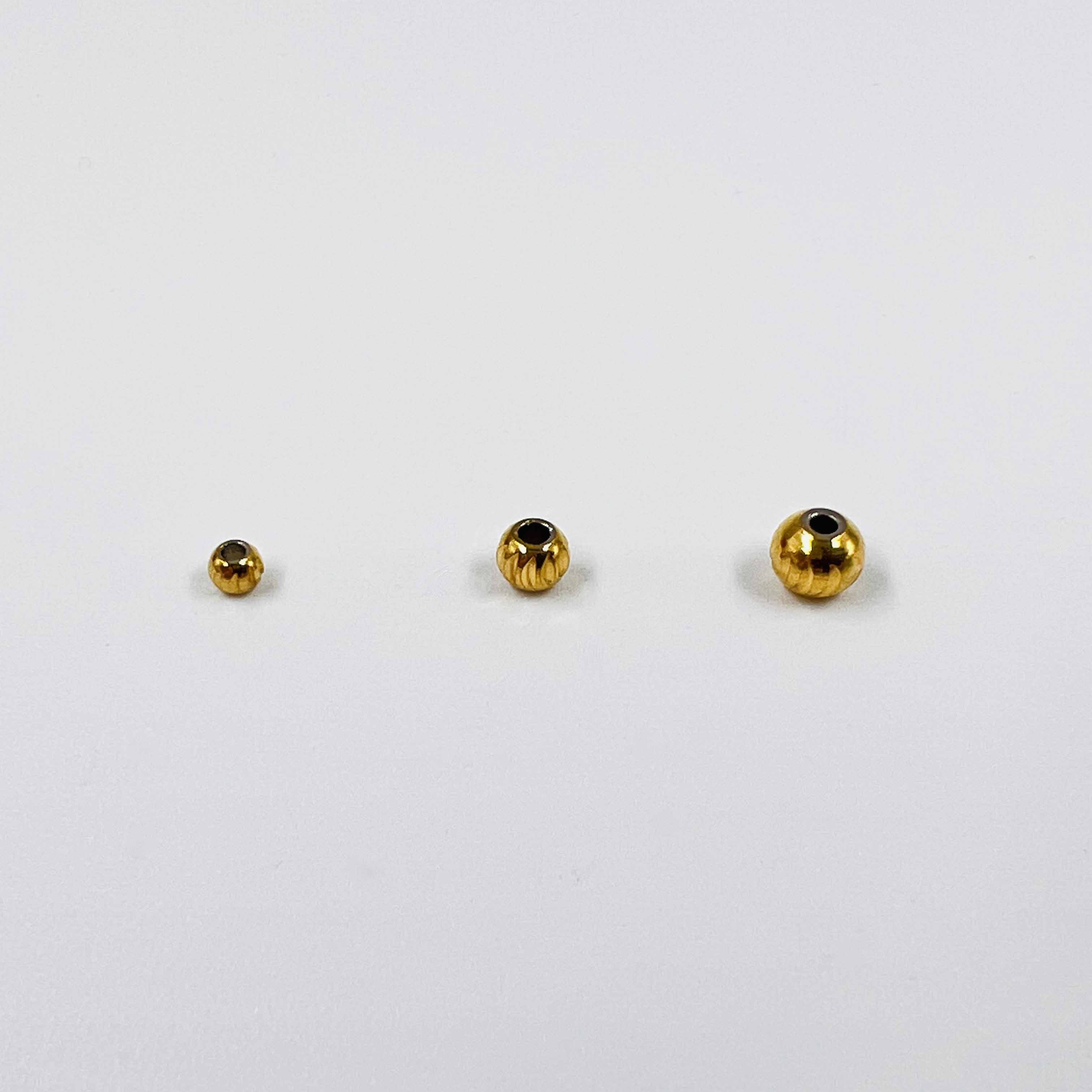 Boules ciselées dorées x5