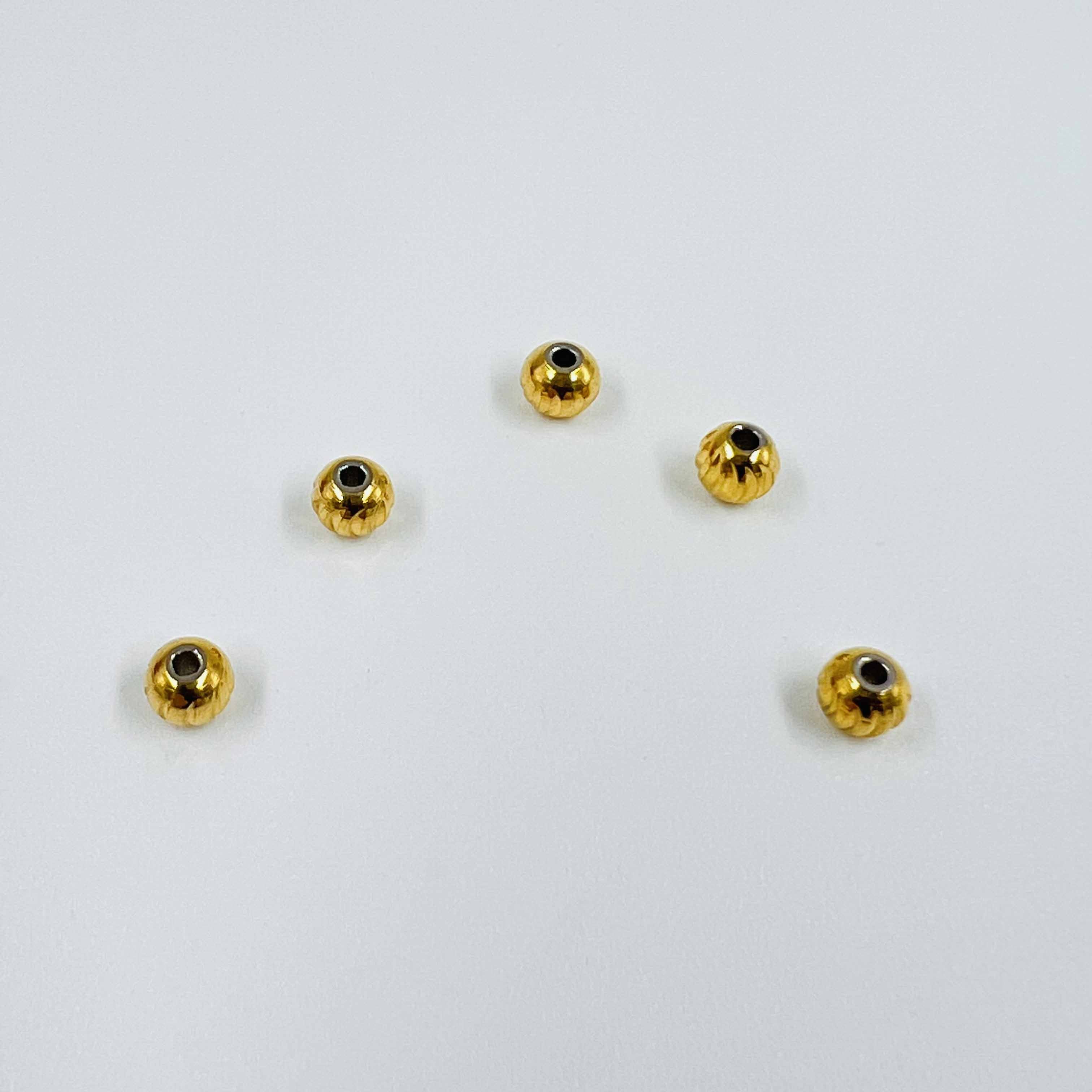 Boules ciselées dorées x5